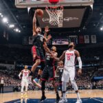 Basketball players in action during Suns vs. Lakers game, symbolizing NBA rivalry